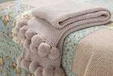 Cosy knit pom pom throw blush